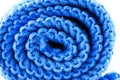 Background made of blue curled microfiber material, front view, macro shot.