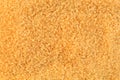 Background made of brown sugar. Crystallized sweetener