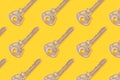 Background made from different metal keys on the yellow base