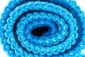 Background made of light blue curled microfiber material, front view, macro shot.
