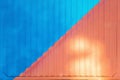 Background made of metal painted in blue and pink on the fence or container backlit by the sun Royalty Free Stock Photo