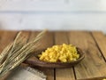 Background made of oak planks and pine planks painted white on the table a bunch of grain wood a wooden spoon with noodles