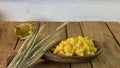 Background made of oak planks and pine planks painted white on the table a bunch of grain wood a wooden spoon with noodles