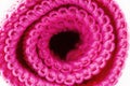 Background made of pink curled microfiber material, front view, macro shot.