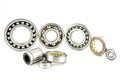 Background made of several ball bearings, isolated on a white background, selective focus, in the background the bearings standing Royalty Free Stock Photo