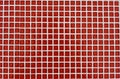 Background made of square small red mosaic with copy space