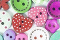 The background is made up of multicolored buttons of different sizes and shapes. Royalty Free Stock Photo