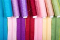 Background made of zippers and coils with threads of different colors. Royalty Free Stock Photo