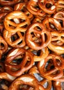 Background many baked pretzels for sale in market