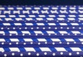 Background of many blue paper tubes with white pea and cocktail strips lie diagonally across the screen in close up