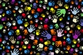 Background of many color prints of hands on a black background Royalty Free Stock Photo