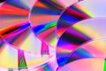 Lots CDs shiny colourful background. Royalty Free Stock Photo