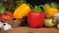 A background of many vegetables including pepper tomatoes garlic mushrooms vegetables on a wooden board Royalty Free Stock Photo