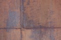 background of metal surface covered with tin sheets with brown rust Royalty Free Stock Photo