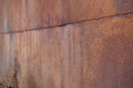 background of metal surface covered with tin sheets with brown rust Royalty Free Stock Photo