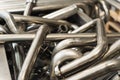 Background of metal twisted pipes. Brilliant clean indirect tubes.