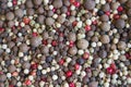 Background of a mixture of dry pepper peas black, red, white colors