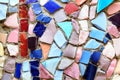 Background from a mosaic of different shapes of tiles and multicolors