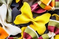 Background from multi-colored pasta bows and striped. Selective focus. Royalty Free Stock Photo