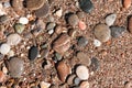 Background from multi-colored stones. Texture of sea stones. Red and blue pebbles. Stone beach. Minerals. Colorful stone. Royalty Free Stock Photo