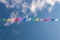 Background with multicolored flags and sky with clouds Royalty Free Stock Photo