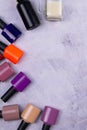 Background of multicolored nail polish samples. Top view of the color palette of nail services in beauty salon. Fashion manicure. Royalty Free Stock Photo