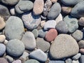 Background from multicolored pebbles. Black sand. Pebble coast. Stone beach. Stone pattern Royalty Free Stock Photo