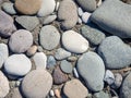 Background from multicolored pebbles. Black sand. Pebble coast. Stone beach. Stone pattern Royalty Free Stock Photo