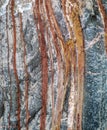 Background of multiple colorful stripy style rock