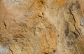 Background of natural coarse stone removed by sunny day frontal Royalty Free Stock Photo