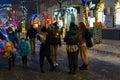 Background of a night Christmas town with people walking in the dark. December 28, 2021 Balti Moldova.