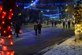 Background of a night Christmas town with people walking in the dark. December 28, 2021 Balti Moldova.