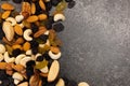 Background of nuts - pecan, macadamia, brazil nut, walnut, almonds, hazelnuts, pistachios, cashews, peanuts, pine nuts - with copy