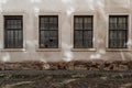 Background from an old, abandoned house with old, dirty windows. Some windows knocked out