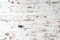 Background of old antique dirty brick wall with peeling plaster and peeling white paint, texture Royalty Free Stock Photo