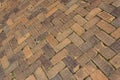 Background of old brick pavers, surface pattern, herringbone layout Royalty Free Stock Photo