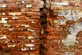 Background of an old brick red wall with a crack in the middle Royalty Free Stock Photo