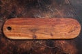 Background with old empty wooden cutting board. Dark background. Top view. Copy space Royalty Free Stock Photo