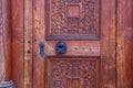 background of old grunge, medieval wooden texture. part of antique old door with iron antique knob Royalty Free Stock Photo