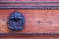 background of old grunge, medieval wooden texture. part of antique old door with iron antique knob Royalty Free Stock Photo