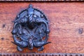 background of old grunge, medieval wooden texture. part of antique old door with iron antique knob Royalty Free Stock Photo