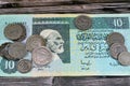 Background of old Libyan money banknote bills and coins of different eras from the kingdom to Jamahiriya of Libya times, vintage Royalty Free Stock Photo