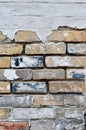 Background old masonry of red brick. Plaster, concrete, cement. Cracks, peeling, voids. Close-up Royalty Free Stock Photo