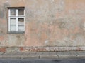 Background of old plastered cracked wall with a window Royalty Free Stock Photo