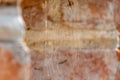 background of an old red brick wall. An unusual design made of bricks and cement of an old building. Cobwebs on the surface of an Royalty Free Stock Photo