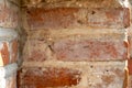 background of an old red brick wall. An unusual design made of bricks and cement of an old building. Cobwebs on the surface of an Royalty Free Stock Photo