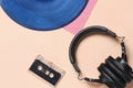 Background, old retro vinyl records, headphones and an audio cassette. Royalty Free Stock Photo