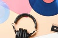 Background, old retro vinyl records, headphones and an audio cassette. Royalty Free Stock Photo