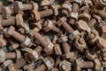 Background from old rusty bolts and nuts lying in a heap Royalty Free Stock Photo