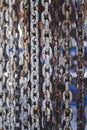 Old rusty metal chains with large links in a port Royalty Free Stock Photo